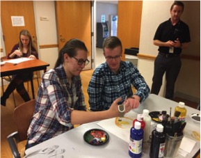 Student
              engaging in activity with patient at Craig Hospital