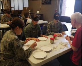 Students at
              CSDB making sandwiches while blind-folded